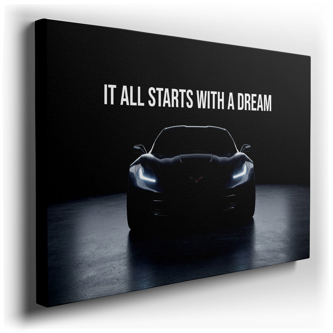 Canvas art featuring a sleek Corvette in dramatic light with the text It All Starts With A Dream. Automotive decor.
