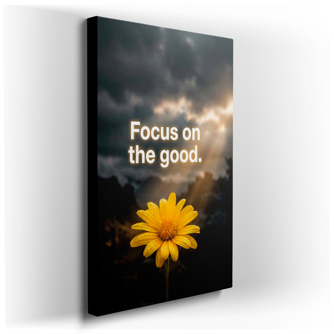 Radiant yellow flower and the words 'Focus on the good' create a positive wall art piece against a dramatic sky backdrop.