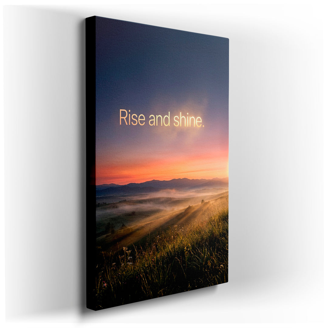 Sunrise landscape wall art with 'Rise and shine' text; fog-kissed hills, radiant light, and vibrant sky create inspiring home decor.