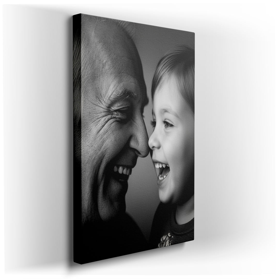 A black and white wall art photograph shows an elderly man and a young child laughing face to face, noses nearly touching.