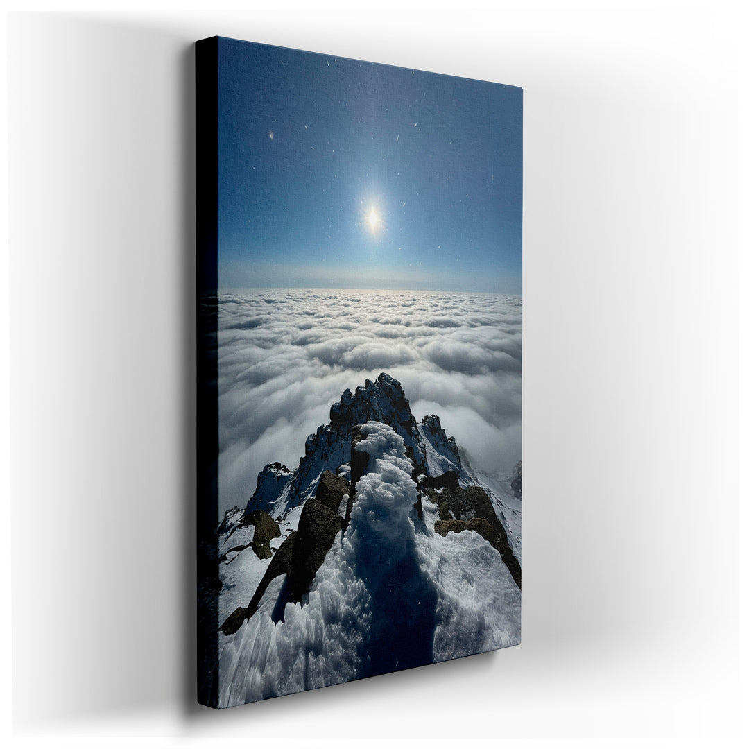 Canvas wall art of a snow-covered mountain peak piercing through a sea of clouds, bathed in sunlight. A captivating wall decor piece.