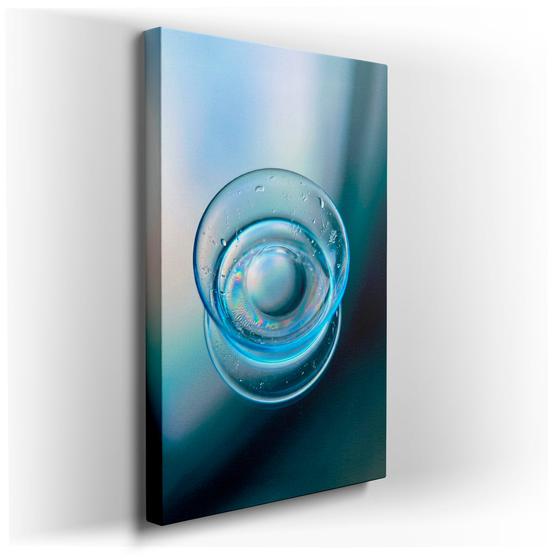 Close-up wall art featuring a clear water drop with iridescent reflections, creating a modern and abstract home decor piece.