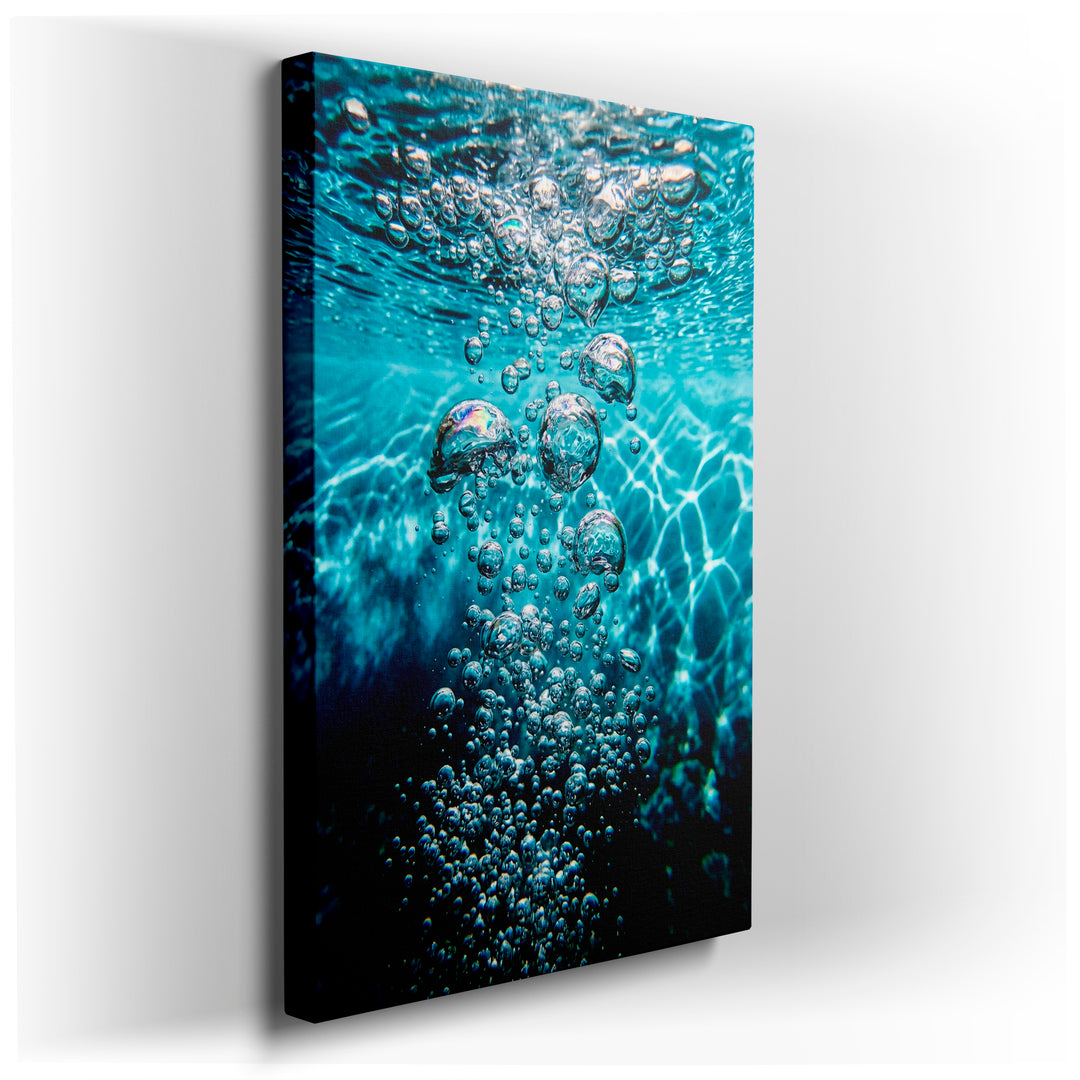 Close-up wall art showing clear turquoise water with many ascending bubbles, creating a serene and calming atmosphere.