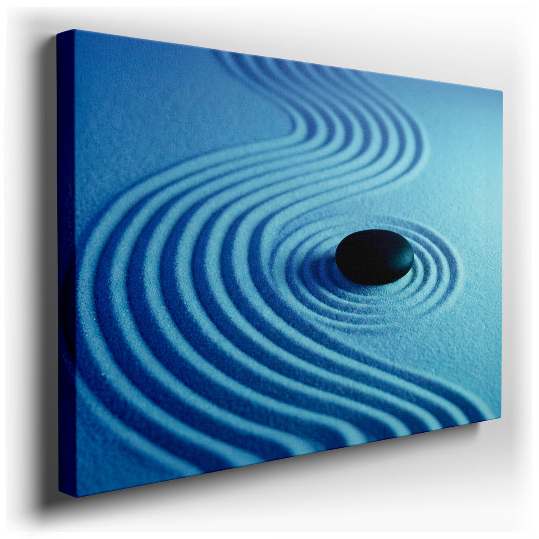 Zen garden wall art featuring a black stone on raked sand, creating a peaceful and minimalist aesthetic.