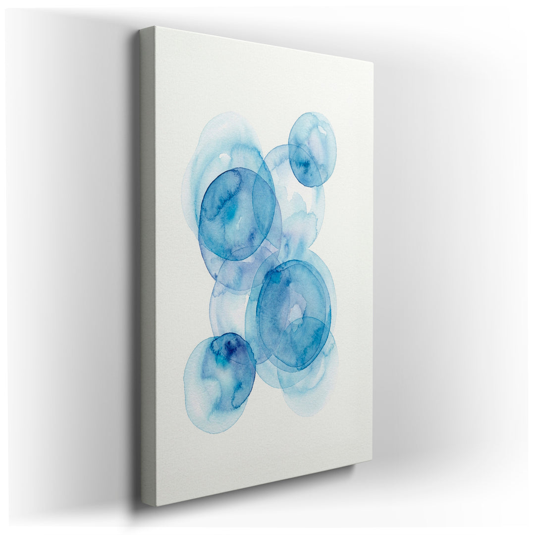 Abstract wall art featuring overlapping blue watercolor circles creating a calming and modern aesthetic on a Wrapped Canvas.