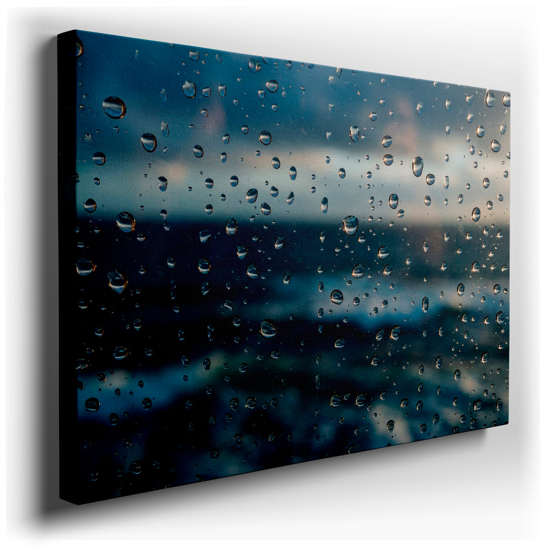 Close-up wall art of rain drops on a window, creating an abstract, blurred view of the outside world as serene wall decor.
