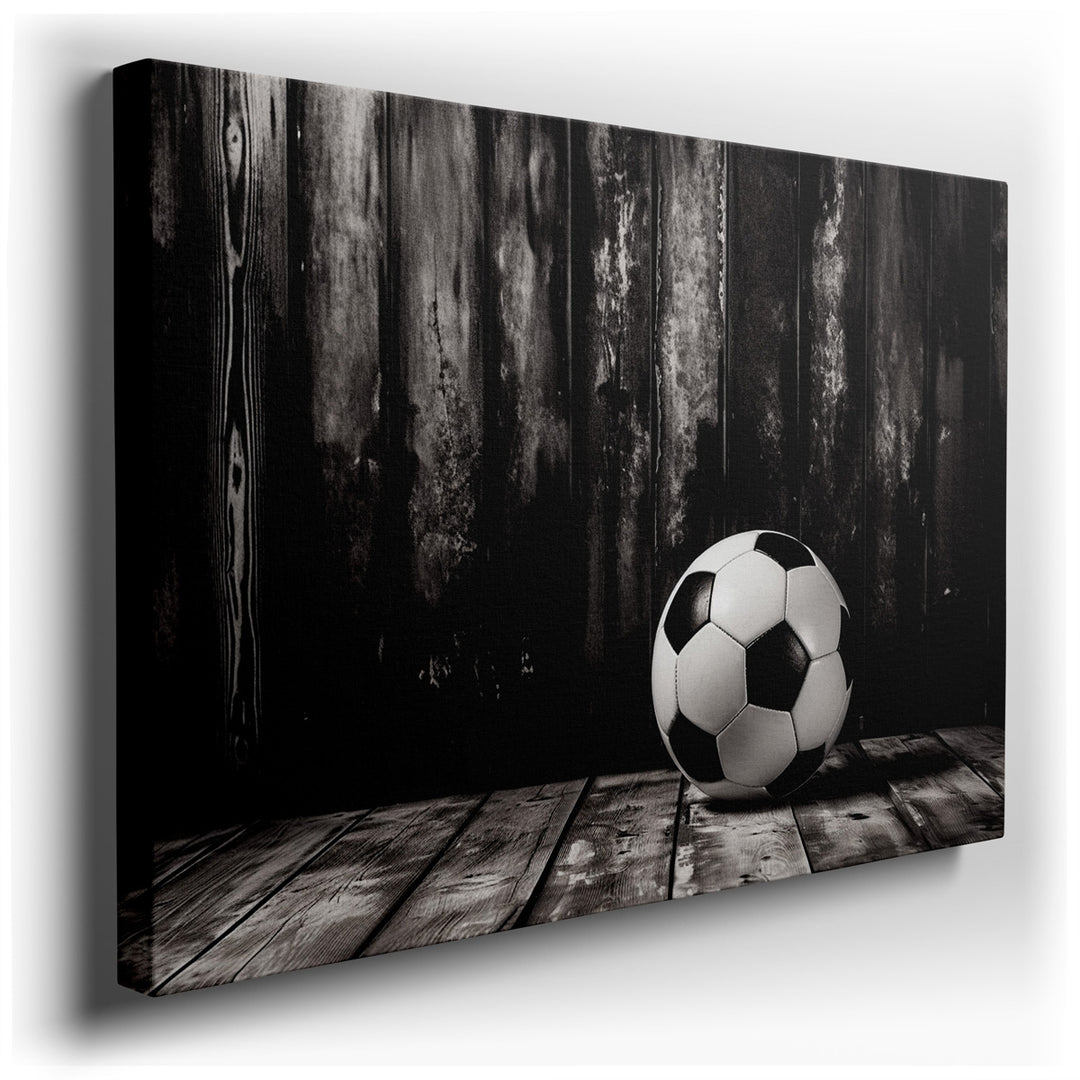 canvas print on wrapped canvas for wall decor – This captivating black and white photograph of a soccer ball, resting gracefully on a rustic wooden floor, is a masterpi...