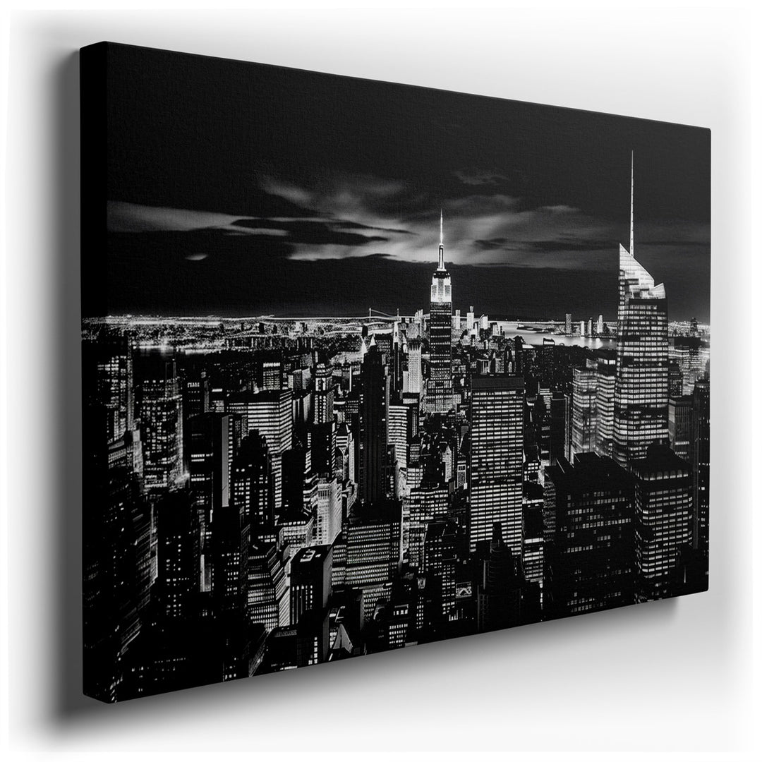 canvas print on wrapped canvas for wall decor – This wall art offers a breathtaking black and white portrayal of New York City's skyline at night, capturing the essence...