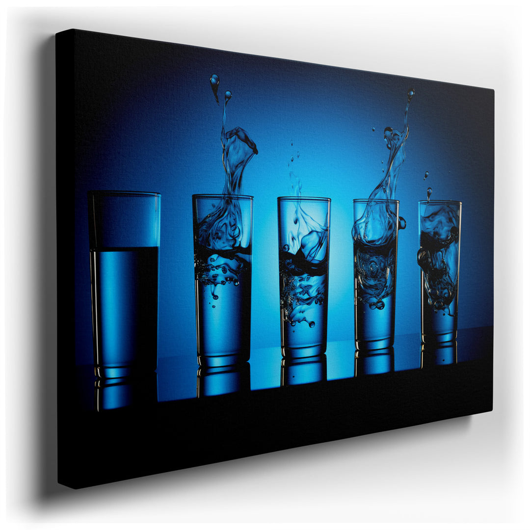 canvas print on wrapped canvas for wall decor – This wall art captures a moment of dynamic elegance and fluid motion, featuring a series of clear glasses through which...