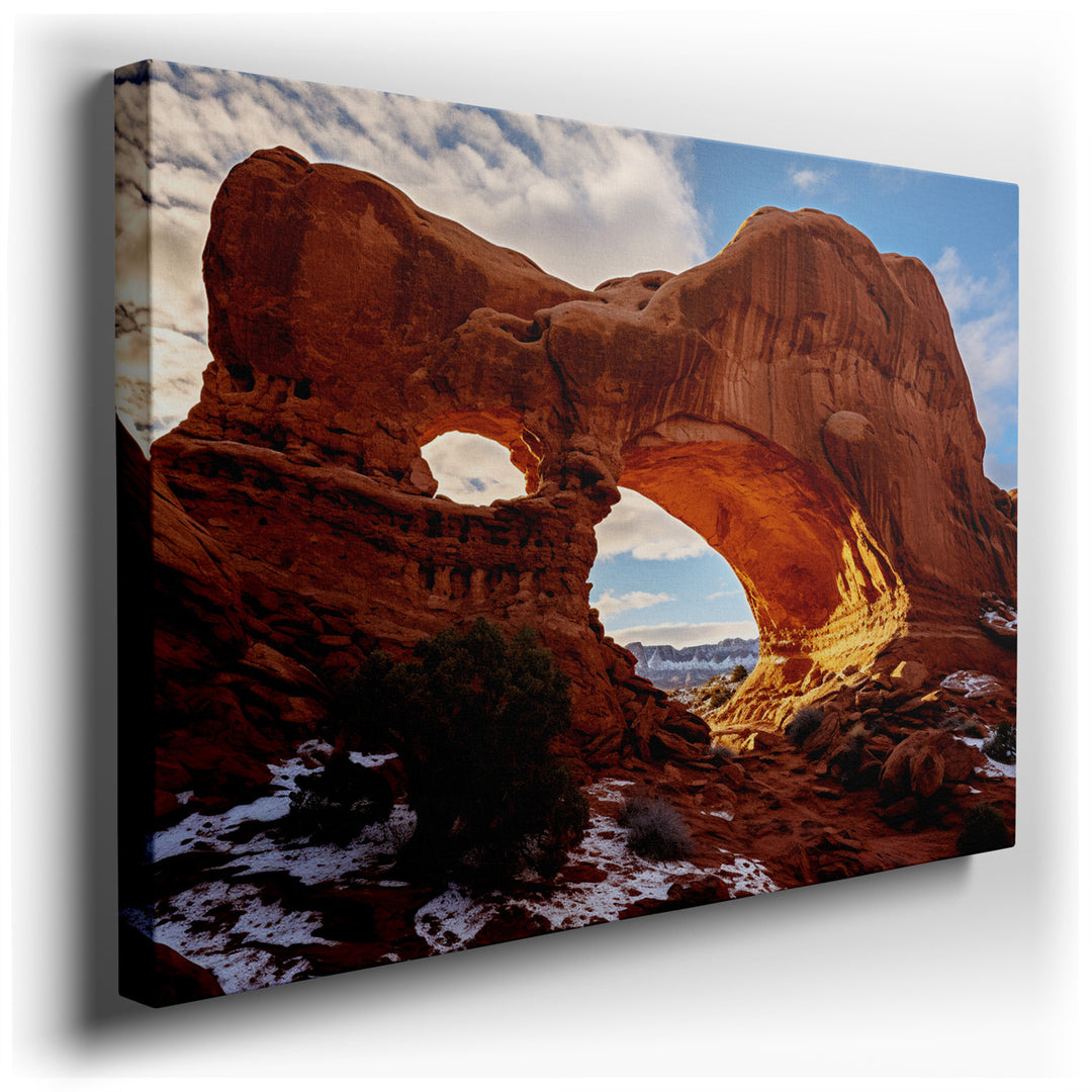 canvas print on wrapped canvas for wall decor – This wall art captures the awe-inspiring majesty of a natural rock formation characterized by its dramatic arches, which...