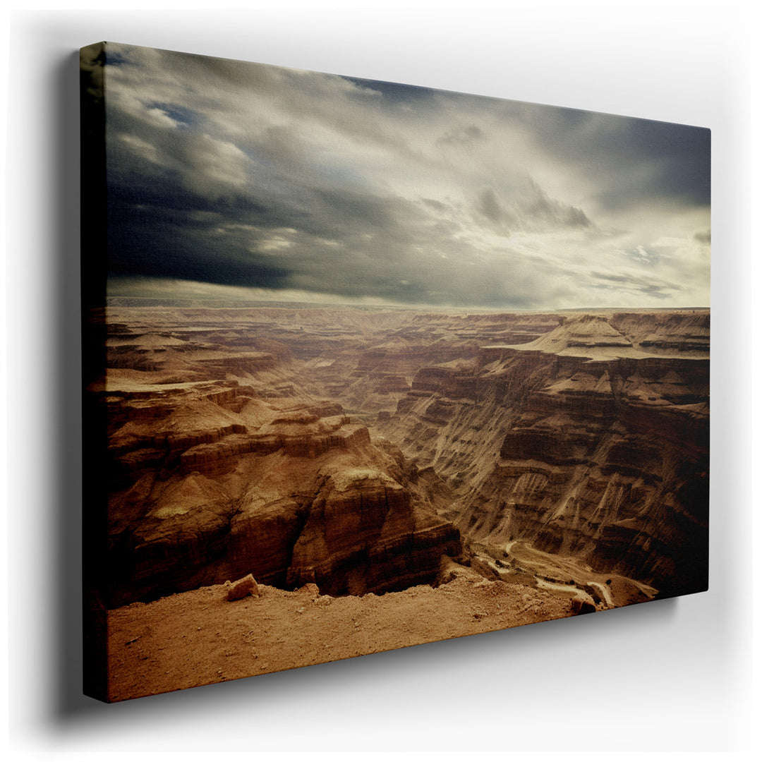 canvas print on wrapped canvas for wall decor – This wall art, a captivating portrayal of a canyon landscape under an overcast sky, is a masterpiece that brings the wil...