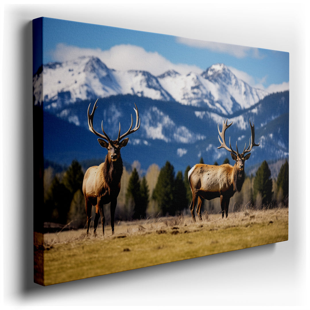 canvas print on wrapped canvas for wall decor – This wall art captures a serene yet powerful scene of nature's grandeur, featuring two majestic elk standing in a vast,...