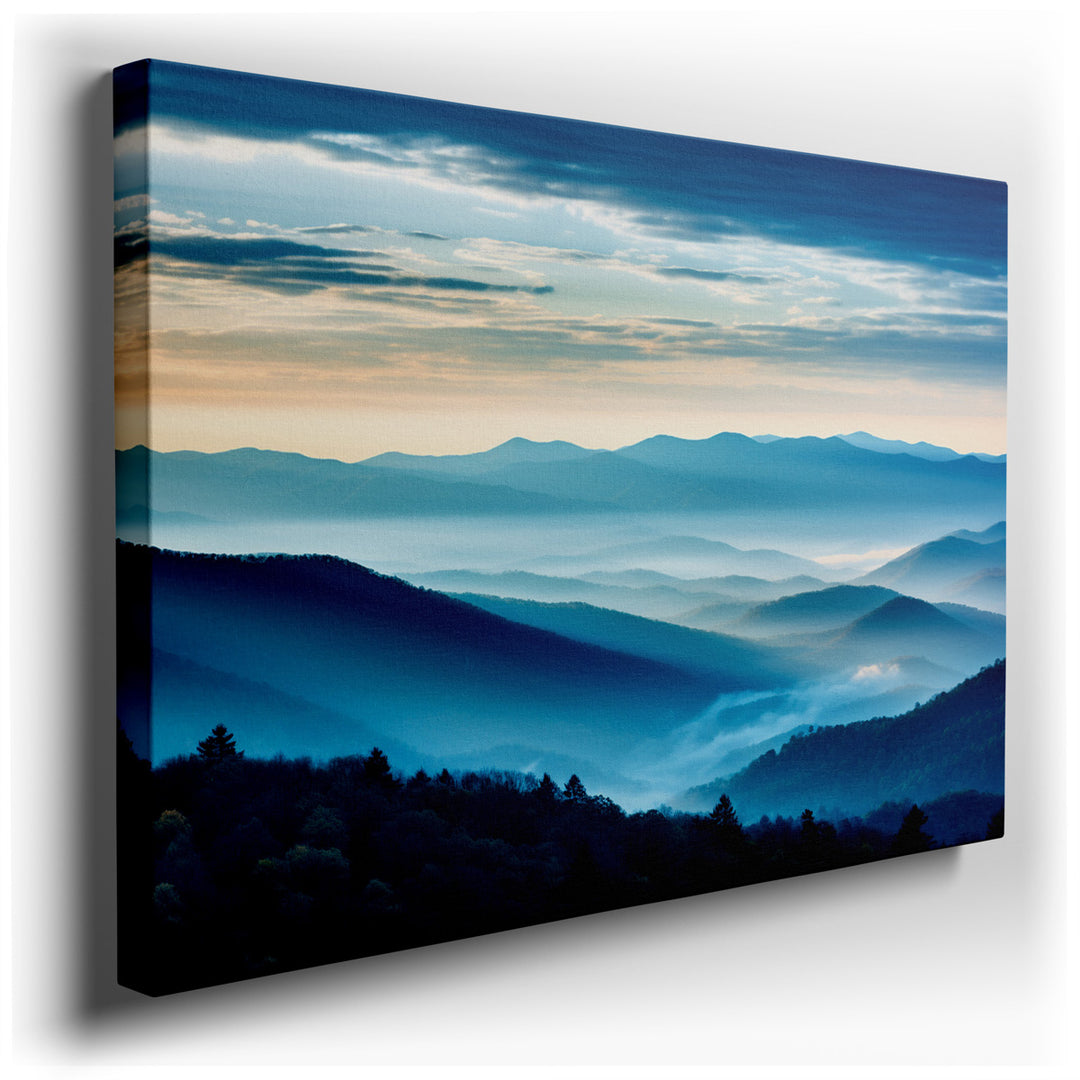 canvas print on wrapped canvas for wall decor – This enchanting wall art captures the ethereal beauty of a misty mountain range at the break of dawn, offering a visual...