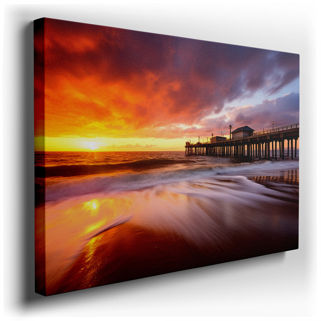canvas print on wrapped canvas for wall decor – This exquisite wall art portrays a mesmerizing sunset over a serene ocean pier, where the golden sands gracefully conver...