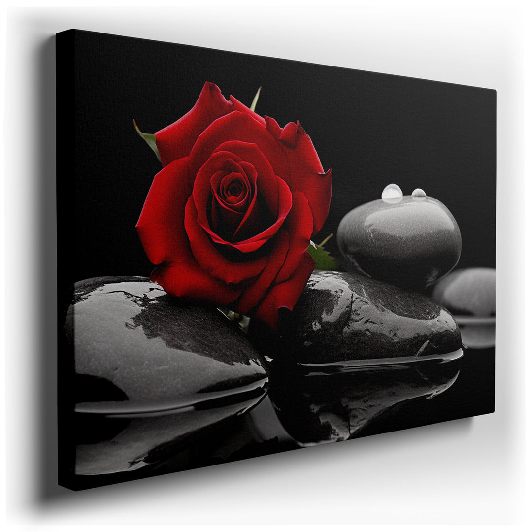 canvas print on wrapped canvas for wall decor – This wall art, a masterful depiction of a vibrant red rose delicately resting on smooth black stones, is a visual sympho...