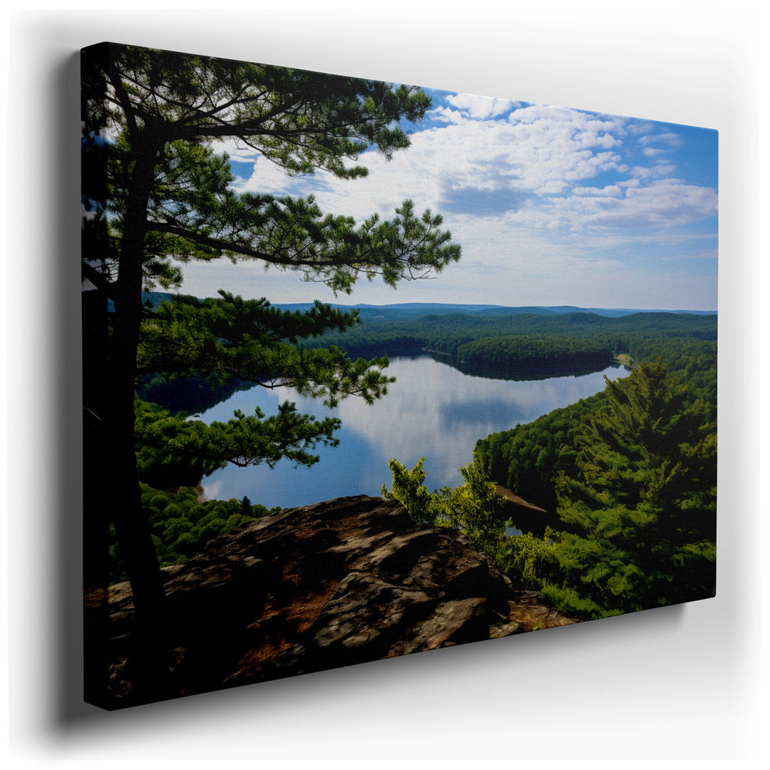 canvas print on wrapped canvas for wall decor – This enchanting wall art portrays a tranquil lake, a serene body of water that mirrors the lush, verdant forests surroun...
