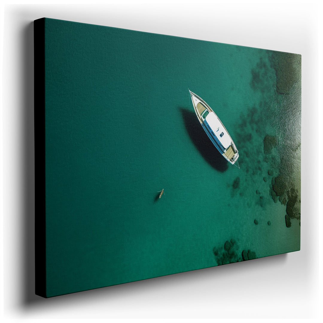 canvas print on wrapped canvas for wall decor – This exquisite aerial photograph captures the essence of tranquility and solitude through its depiction of a solitary bo...