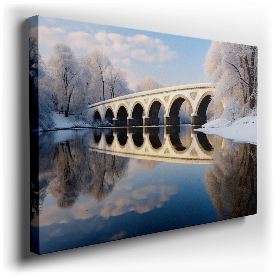 canvas print on wrapped canvas for wall decor – This enchanting wall art captures the serene beauty of a winter landscape, centered around an elegant arch bridge that g...