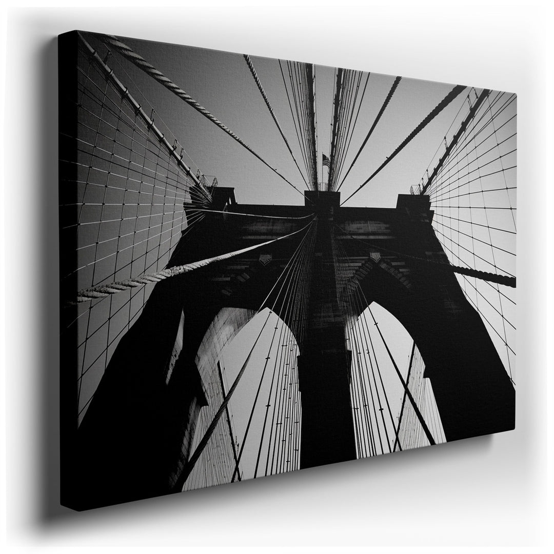 canvas print on wrapped canvas for wall decor – This wall art, a dramatic black-and-white portrayal of the Brooklyn Bridge, captures the viewer's attention with its awe...