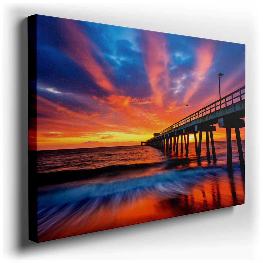 canvas print on wrapped canvas for wall decor – This enchanting wall art captures the breathtaking beauty of a sunset descending over a tranquil pier, masterfully rende...
