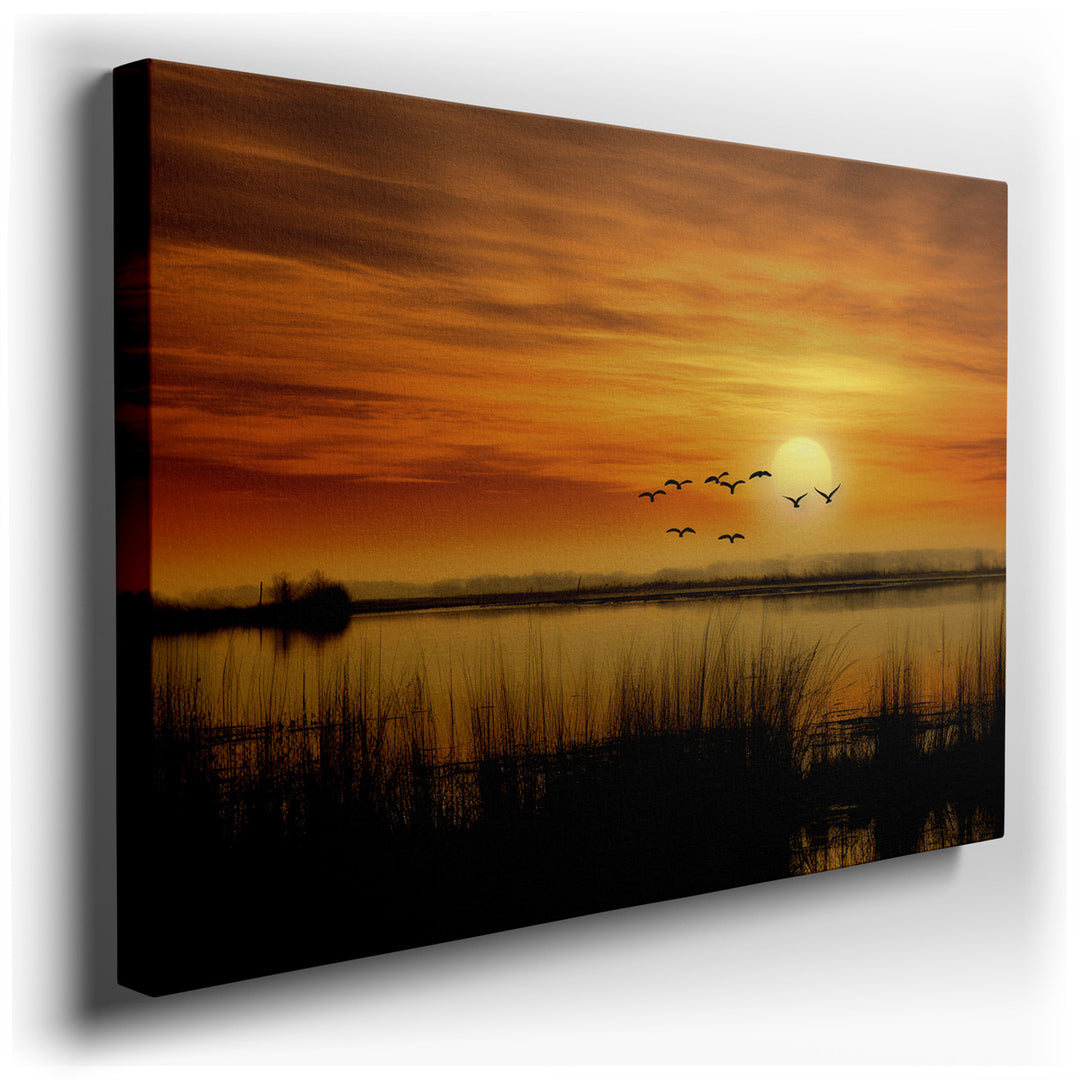 canvas print on wrapped canvas for wall decor – This exquisite wall art captures the ethereal beauty of a sunset, where the golden sun dips low over tranquil waters, ca...