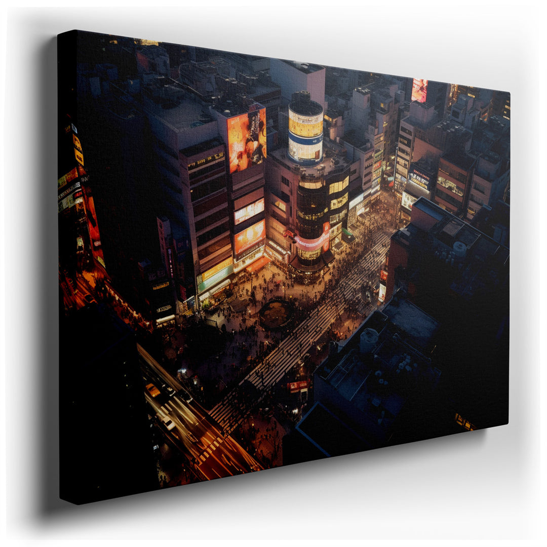 canvas print on wrapped canvas for wall decor – The wall art in question offers a captivating aerial perspective of a bustling urban intersection during the vibrant hou...