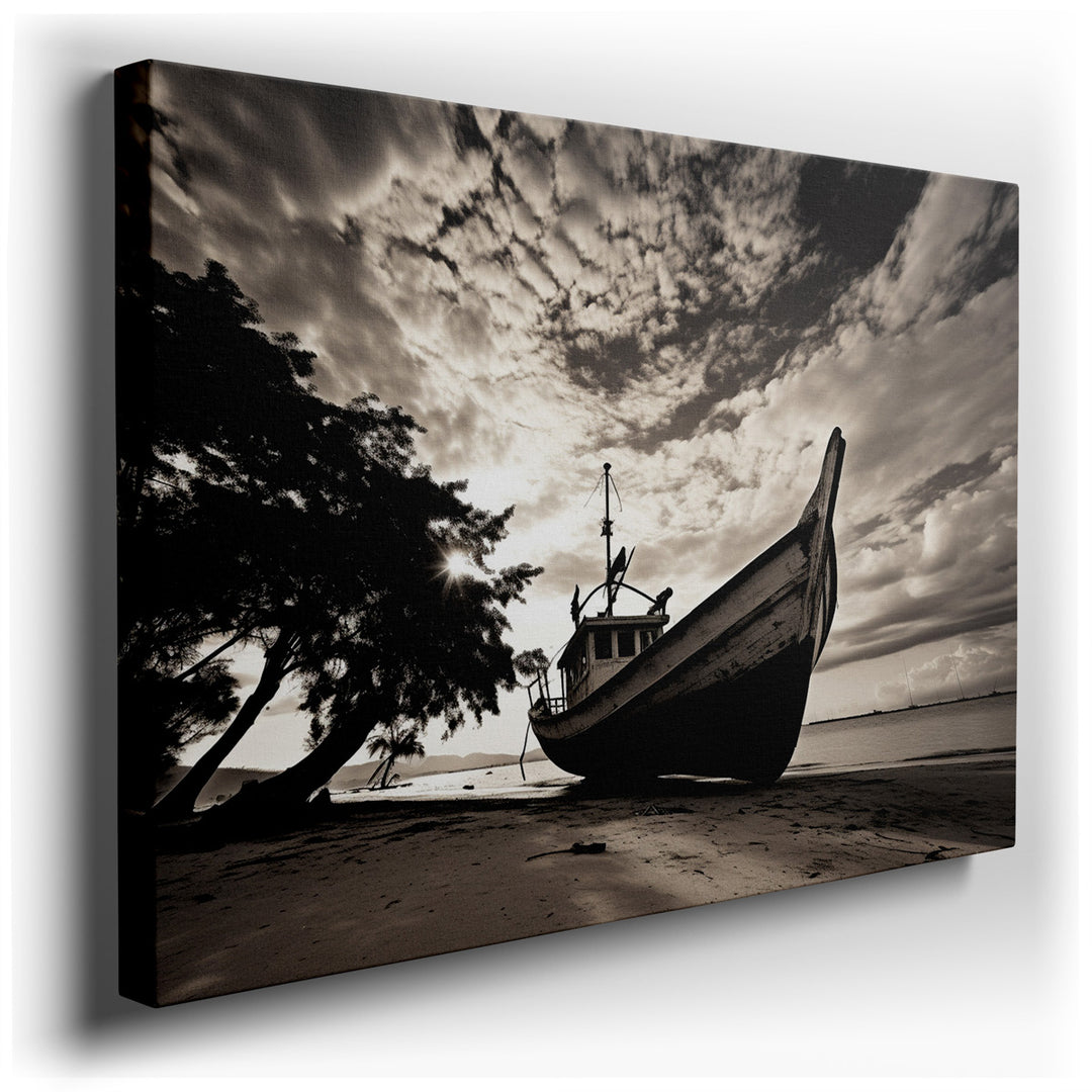 canvas print on wrapped canvas for wall decor – This evocative black and white wall art captures a vintage fishing boat, abandoned and resting solemnly on a sandy beach...